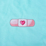 Women's Fitted Eco-Friendly T-Shirt Band-Aid Aqua Organic Cotton El arte de cuidar" ("The Art of Caring")