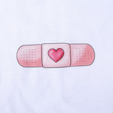 Women's Fitted T-Shirt Band-Aid White 100% Cotton  "El arte de cuidar" ("The Art of Caring") 